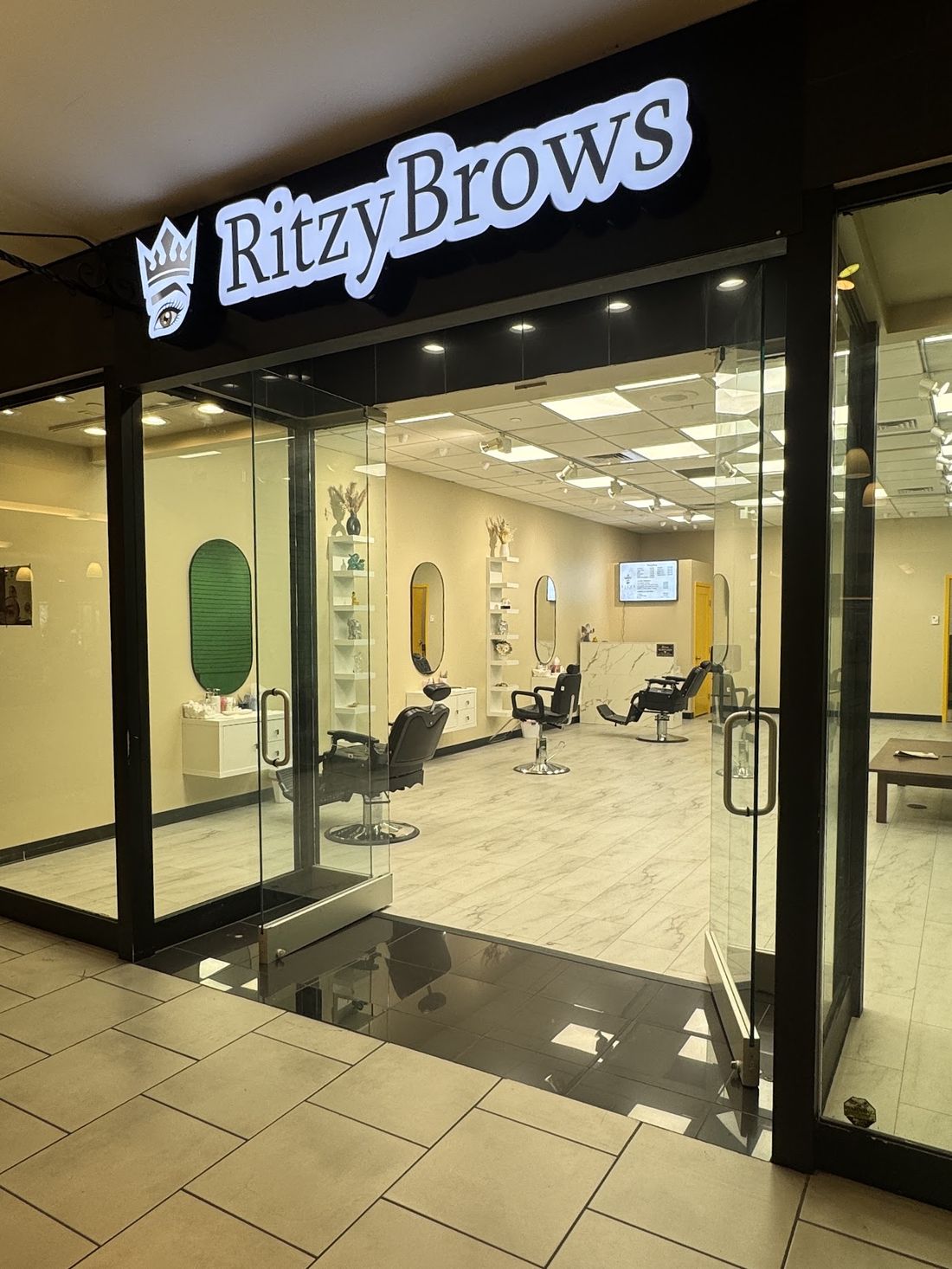 The Ritzy Brows storefront inside Mondawmin Mall